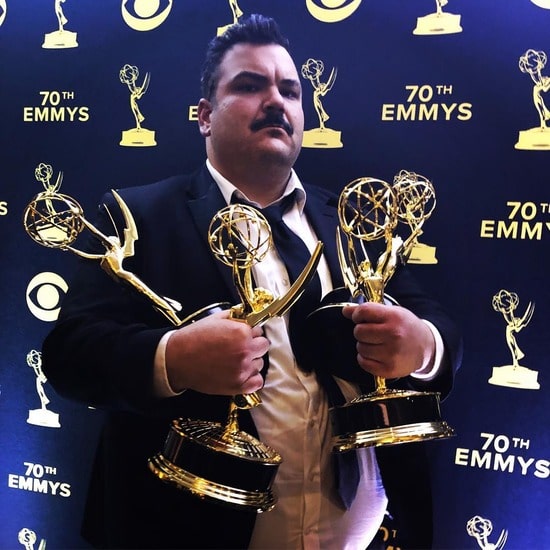 Ian Karmel holding his Primetime Emmy Award